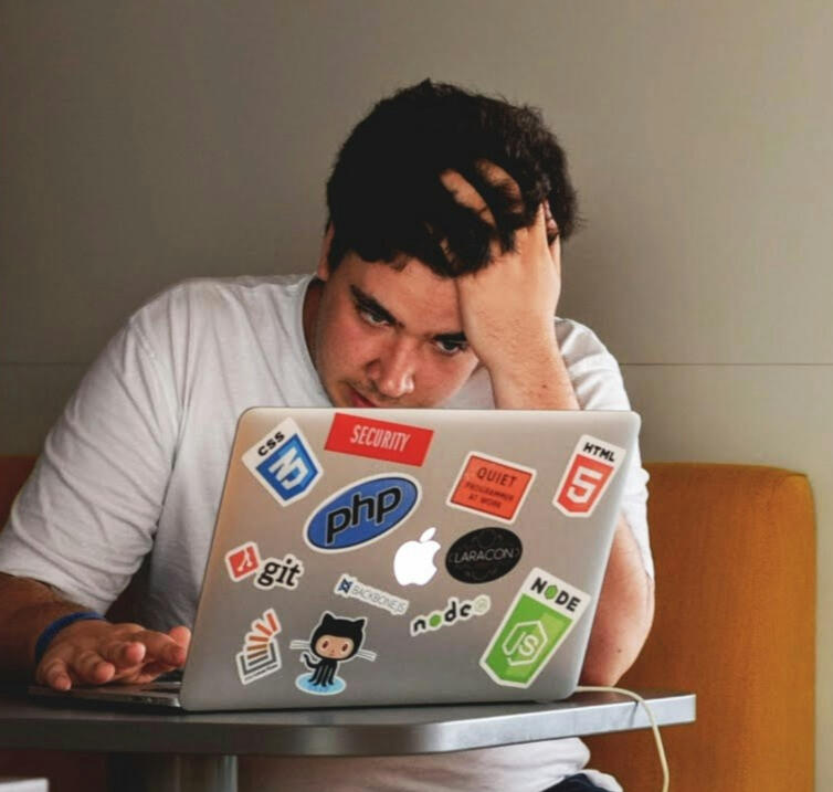 Frustrated international student struggling to find student housing online in the Netherlands