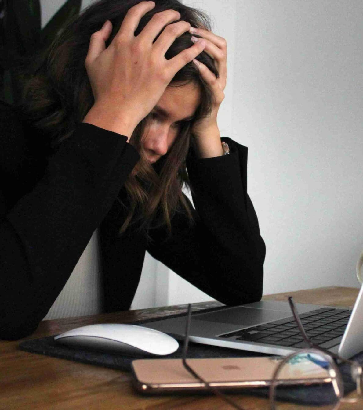 Stressed international student struggling to find student housing online in the Netherlands